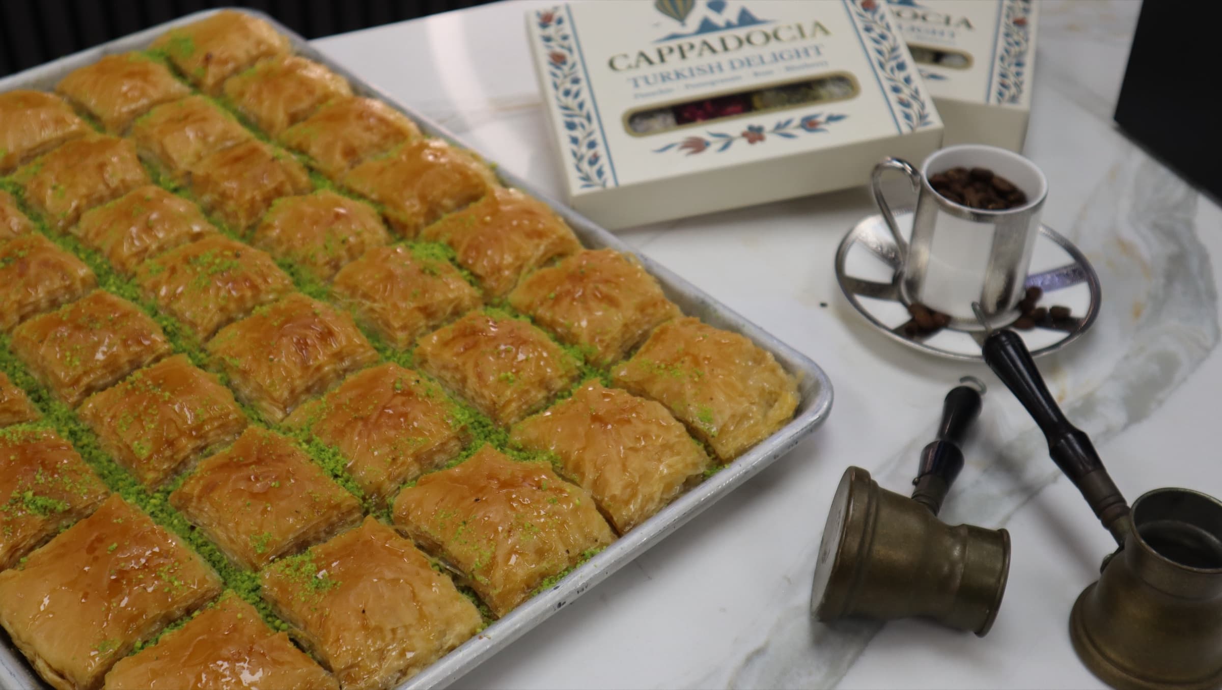 A tray of baklava with Turkish coffee