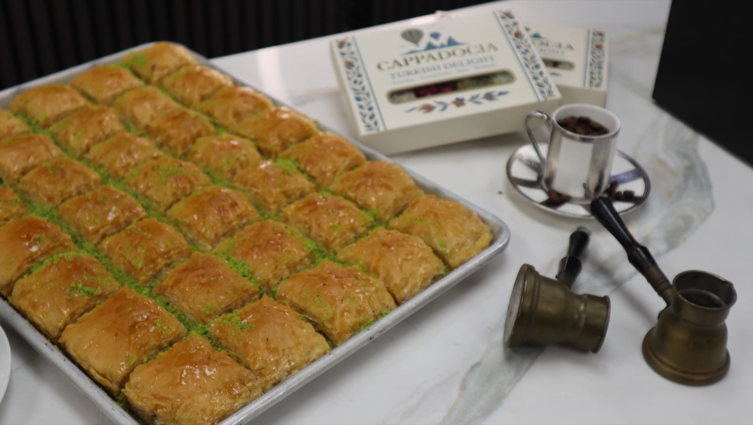 Baklava with a box of Turkish delight and coffee
