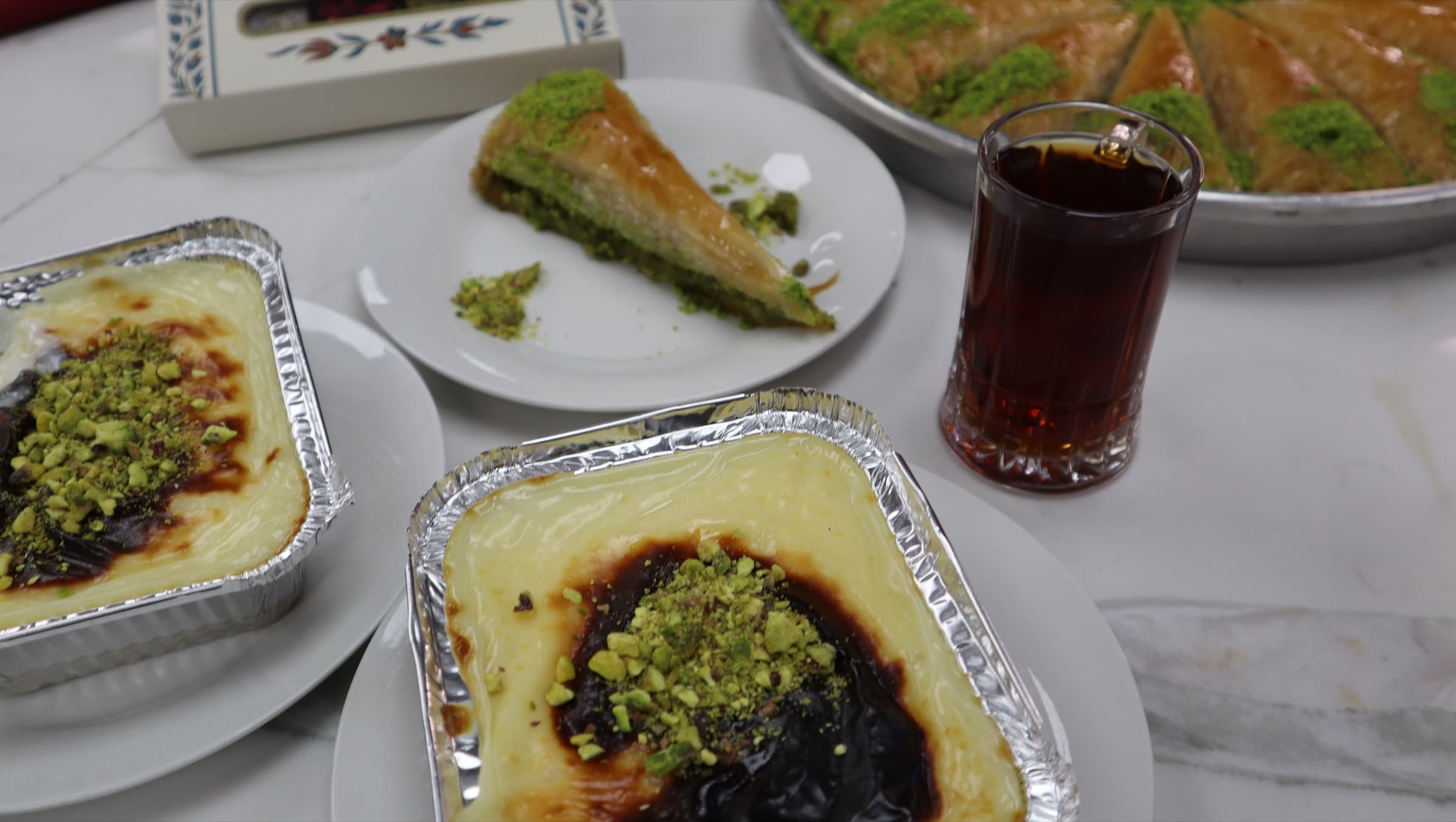 A spread of Turkish desserts and tea